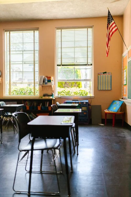 Classroom with desks and learning materials